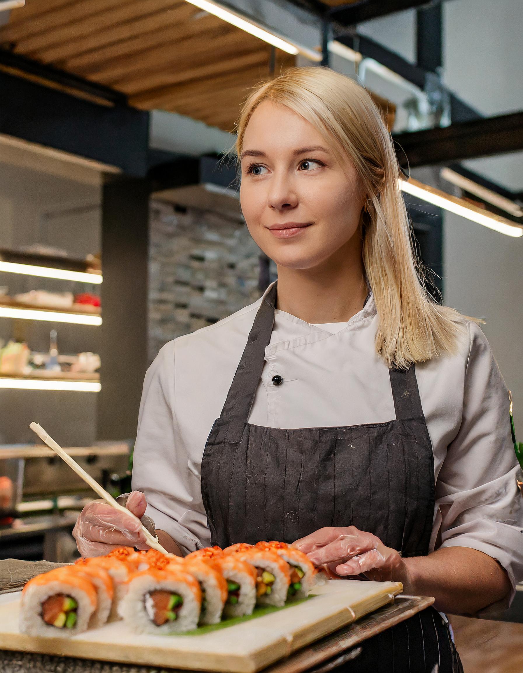 sushi chef working in a busy kitchen